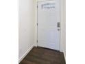 Bright entryway featuring a white door with decorative glass and wood flooring at 170 Gilreath Nw Rd, Cartersville, GA 30121