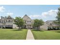 Inviting two-story home with manicured front lawn, brick accents, and charming curb appeal at 1840 Brighton Se Blvd, Atlanta, GA 30316