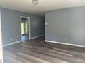 Inviting living room featuring newly installed floors and neutral walls, creating a cozy and modern atmosphere at 2875 Carriage Ln, Atlanta, GA 30349