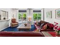 Cozy living room with comfortable seating, a decorative fireplace, and ample natural light at 1421 Peachtree Ne St # 214, Atlanta, GA 30309