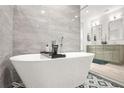 Contemporary bathroom featuring a freestanding tub, sleek tiling, and dual vanities for a spa-like experience at 2318 Polar Rock Terrace, Atlanta, GA 30315