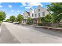 Picturesque street view featuring a row of well-maintained homes with lush landscaping and a tranquil, suburban setting at 110 3Rd St, Fayetteville, GA 30214