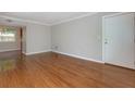 Spacious living room with hardwood floors, and neutral paint at 100 Biscayne Nw Dr # D7, Atlanta, GA 30309