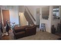 Open living space with a staircase, cozy seating, and an inviting atmosphere at 335 Chase Woods Cir, Jonesboro, GA 30236
