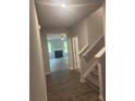 Hallway with view into living room with a fireplace and plenty of natural light at 1155 Park Center Cir, Austell, GA 30168