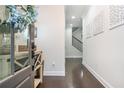 Bright entryway with hardwood floors and decorative wall art at 2024 Towneship Trl, Roswell, GA 30075