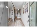 Welcoming home foyer featuring hardwood floors, stylish decor, and a staircase at 4200 Legacy Ln # 22, Acworth, GA 30101