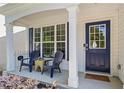 Inviting front porch featuring comfortable seating and a stylish door with a glass window at 11255 Wittenridge Dr, Alpharetta, GA 30022