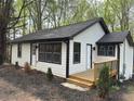 Exterior of a modern home with new siding and deck at 12778 Cumming Hwy, Canton, GA 30115