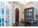 Charming foyer featuring hardwood floors, a stylish cabinet, and abundant natural light at 2370 Bradwardine Ct, Cumming, GA 30041