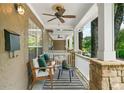 Inviting covered porch with seating and ceiling fan, perfect for relaxing outdoors at 3200 Seven Pines Ct # 103, Atlanta, GA 30339