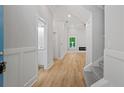 Inviting home entryway featuring hardwood floors, neutral walls, and access to bathroom at 3902 Bouldercrest Se Rd, Ellenwood, GA 30294