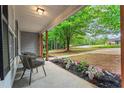 View from the front porch to the lawn, landscaping, and neighborhood at 2565 Bates Se St, Smyrna, GA 30080