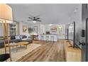 Open-concept living area with hardwood floors, modern furnishings, and abundant natural light at 2565 Bates Se St, Smyrna, GA 30080