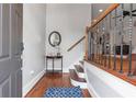 Inviting foyer with hardwood floors and staircase at 2690 Derby Ne Walk # 53, Atlanta, GA 30319