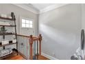 Upstairs landing with hardwood floors and decorative shelving at 2690 Derby Ne Walk # 53, Atlanta, GA 30319