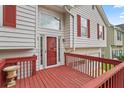 Inviting front porch featuring a red deck, offering a charming entryway to the home at 2746 Sanibel Se Ln, Smyrna, GA 30082