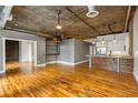 Hardwood floors flow throughout the spacious living area, complemented by modern lighting at 3235 Roswell Ne Rd # 521, Atlanta, GA 30305