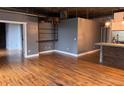 Open concept living room and kitchen area featuring hardwood floors and neutral walls at 3235 Roswell Ne Rd # 521, Atlanta, GA 30305