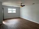 Bright living room features hardwood floors, neutral paint, natural light and ample space. Ready for your decor at 226 Walnut Nw St, Atlanta, GA 30314