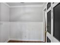 Entryway with white wainscoting and crown molding, creating a bright and welcoming space at 1819 King Alfred Sw Dr, Atlanta, GA 30331