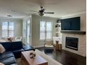 Bright living room featuring a fireplace and large windows, creating a cozy and inviting atmosphere at 2893 Elmwood Dr, Smyrna, GA 30080