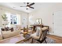 Bright living room with natural light, wood floors, and contemporary decor at 208 Starr Cir, Stockbridge, GA 30281