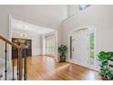 Inviting foyer features hardwood floors, staircase, and a high ceiling at 420 Big Bend Trl, Sugar Hill, GA 30518