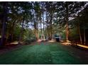 Private backyard with lush lawn and wooded backdrop, perfect for relaxing at 4531 Kings Lake Dr, Marietta, GA 30067