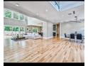 Spacious living room with large windows, hardwood floors, and modern decor at 7504 Rivertown Rd, Fairburn, GA 30213