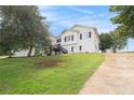Charming two-story home with a long driveway and large front yard at 7760 Poppy Dr, Winston, GA 30187