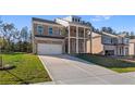 A beautiful two-story brick home featuring a two-car garage and a covered porch for outdoor enjoyment at 101 Belvedere Rd, Mcdonough, GA 30253