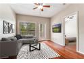 Cozy living room with hardwood floors and lots of natural light at 1250 Parkwood Se Cir # 1203, Atlanta, GA 30339
