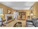 Bright living room with hardwood floors, fireplace, and built-in bookcases for ample storage at 249 Sycamore Pl, Decatur, GA 30030