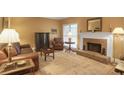 Cozy living room featuring a brick fireplace and comfortable seating arrangement at 249 Sycamore Pl, Decatur, GA 30030
