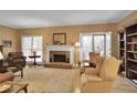 Inviting living room with fireplace, hardwood floors, and access to outdoor space at 249 Sycamore Pl, Decatur, GA 30030