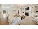 Bright living room with fireplace, built-in shelving, hardwood floors, neutral tones, and comfortable seating at 304 Meadowbrook Ne Dr, Atlanta, GA 30342