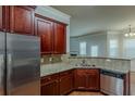 Well-equipped kitchen with stainless steel appliances and granite countertops, adjacent to a bright dining area at 3912 Margaux Dr, Atlanta, GA 30349