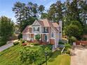 Beautiful 2-story home with lush green landscaping at 825 Yosemite Dr, Suwanee, GA 30024