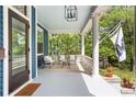 Relaxing front porch area with comfortable seating perfect for enjoying outdoor views at 118 Waverly Way, Atlanta, GA 30307