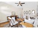 Cozy living room features neutral tones, hardwood floors, and well-coordinated decor and furnishings at 209 Starr Cir, Stockbridge, GA 30281