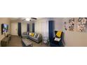 Spacious living area featuring a comfortable sectional, accent chair, and entertainment center at 3385 Martin Luther King Jr Sw Dr, Atlanta, GA 30331