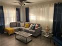 Comfortable living room with a large sectional sofa and plenty of natural light at 3385 Martin Luther King Jr Sw Dr, Atlanta, GA 30331