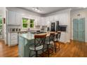 Bright kitchen boasts granite countertops, stainless appliances, and a center island with seating at 1061 Polo Club Nw Dr, Marietta, GA 30064
