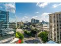 Expansive daytime city view, highlighting sleek buildings and lush greenery in the urban landscape at 3324 Peachtree Ne Rd # 1407, Atlanta, GA 30326