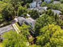 An aerial view of a beautiful home surrounded by lush greenery in a serene neighborhood at 3848 Saint Annes Ct, Duluth, GA 30096
