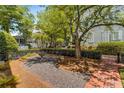The home has a landscaped yard with gravel, brickwork and small fountain at 3848 Saint Annes Ct, Duluth, GA 30096