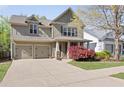 Beautiful home featuring manicured lawn, a two-car garage, and mature landscaping at 516 Winder Trl, Canton, GA 30114