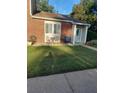 Charming front porch with outdoor seating and well-maintained lawn at 636 North Ave # H-10, Jonesboro, GA 30236