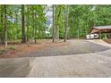 Gated property line with lush green trees at 5259 Sugar Ridge Dr, Sugar Hill, GA 30518